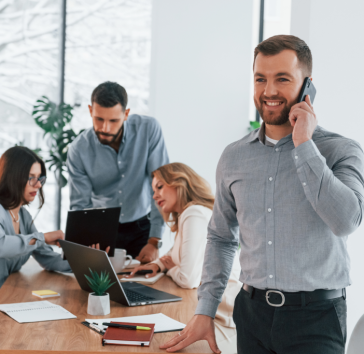 man-with-phone-group-of-business-people.png